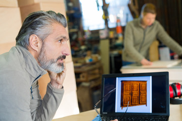 talking on mobile phone in workshop