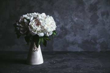 Beautiful peonies on grey concrete background. Wedding, birthday, valentine's day, gift