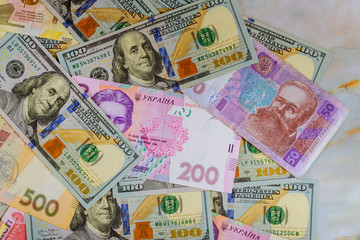 Money dollars and hryvnia, close-up top view concept finance