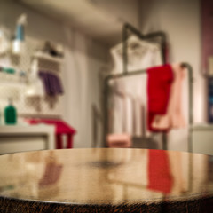 Wooden coffee table of free space for your decoration and blurred background of home interior. 