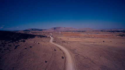 Fototapeta na wymiar desert road from drone shoot