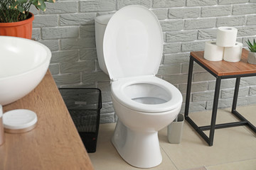 Modern toilet bowl in interior of restroom
