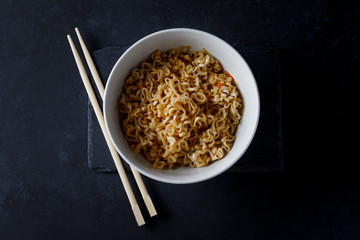 Bowl of noodles on dark backgorund