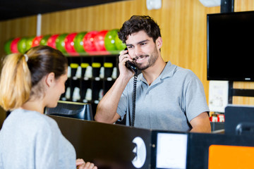 lady at reception desk of bowling hall