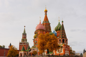 Saint Basil’s Cathedral on Red Square of Moscow, Russia, Spassky (Savior’s) tower of the Kremlin in autumn. Travel or tourism theme or decoration