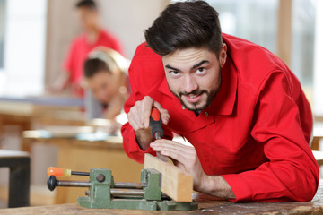 man cutting wood on electric saw