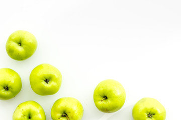 Green apples pattern on white background top view frame copy space