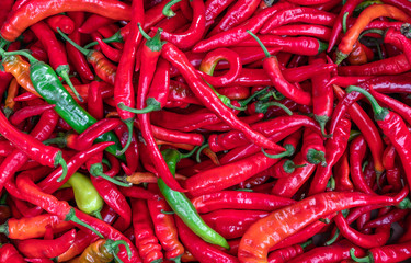 Ripe red chilli pepper for background texture, close-up, top view, copy space for text