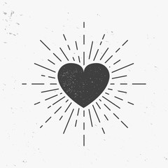 Heart icon with light rays. Vintage heart with stamp effect. Vector illustration © Denys Holovatiuk
