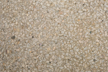 Texture béton désactivé en gros plan avec graviers blanc clair et gris foncé et couleur