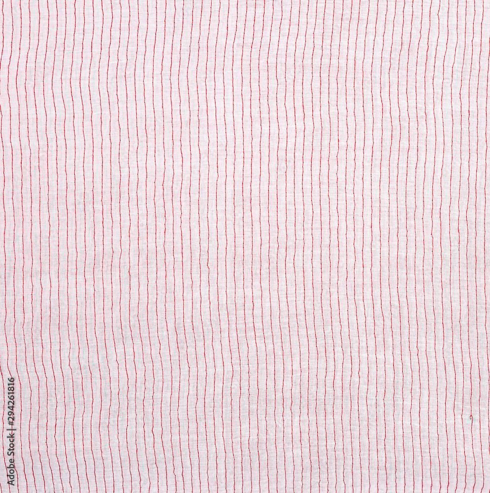 Aufkleber reverse side with a stitching of a red thread of fabric with embroidery with multi-colored sequins