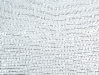 fragment of fabric embroidered with white square sequins, full frame
