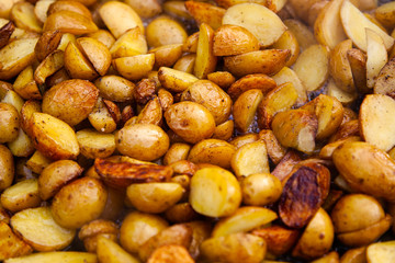 Rustic fried potatoes. Close up background