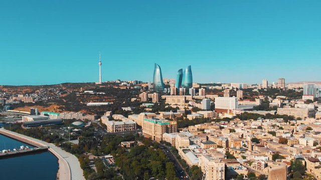 Baku, Azerbaijan. Aerial view coastline of Baku with sea side and city center of the capital and industrial, political and commercial center of Azerbaijan. Panoramic skyline view of Baku