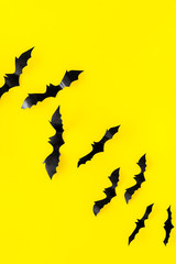 Halloween design. Bats on yellow background top view space for text