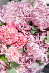 Closeup mixed flowers in bouquet. the work of the florist at a flower shop. Delicate Pastel color. Fresh cut flower. Pink color