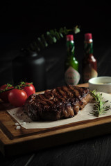 Meat steak on a wooden board. catering menu