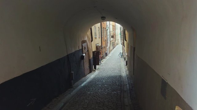 Narrow with arch street in Old Town (Gamla Stan) of Stockholm, Sweden