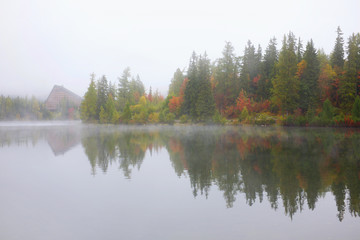 Fototapeta na wymiar Foggy autumn Strbske lake in High Tatras National Park, Slovakia