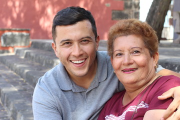 Mother and son smiling outdoors