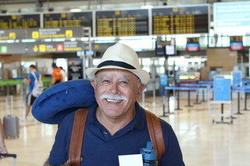 Excited senior traveler at the airport 