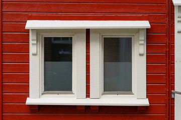 Old red wooden wall with window