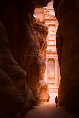 The Tresaury temple (Al Khazneh) framed by the wall of the Siq, Petra, Jordan