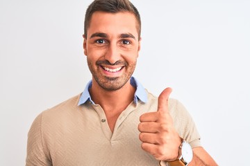 Young handsome man wearing elegant t-shirt over isolated background happy with big smile doing ok...