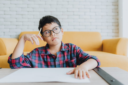 Asian boy thinking about somethings