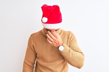 Young handsome man wearing christmas and turtleneck sweater over isolated background tired rubbing nose and eyes feeling fatigue and headache. Stress and frustration concept.