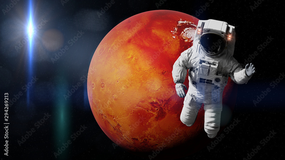 Wall mural astronaut during a space walk in orbit of planet mars