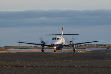 Fototapeta na wymiar Unidentified airplane landing at Hornafjordur airport