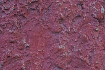 red background from big dirty stone in the wall