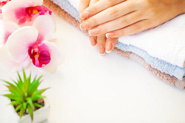 Nails care. Beautiful woman's nails with french manicure, in beauty studio
