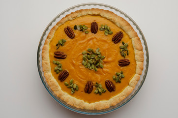 Tasty pumpkin pie, tart made for Thanksgiving day in a baking dish
