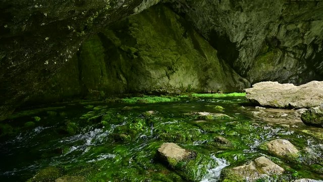 Scenic creek under the rock at Shulgan Tash cave