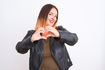 Young beautiful woman wearing t-shirt and jacket standing over isolated white background smiling in love doing heart symbol shape with hands. Romantic concept.