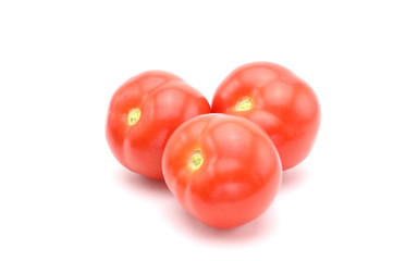 Red tomatoes on white background