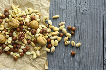 Nuts decorated in a plate on a wooden desk