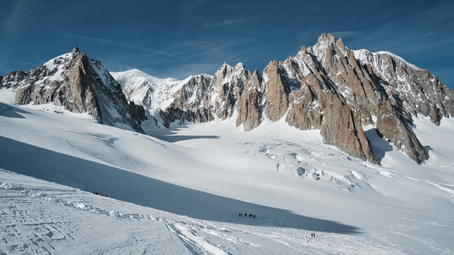 View of the Mont Maudit, Mont Blanc du Tacul and in the distance the Mont Blanc summit with in the foreground the massive glacier