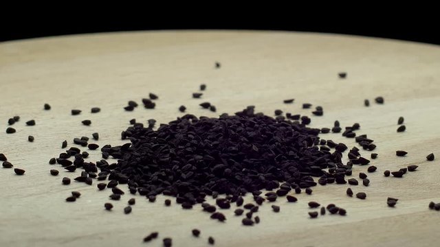 Cumin seeds on a wooden board