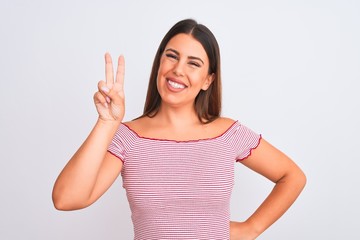 Portrait of beautiful young woman standing over isolated white background showing and pointing up with fingers number two while smiling confident and happy.