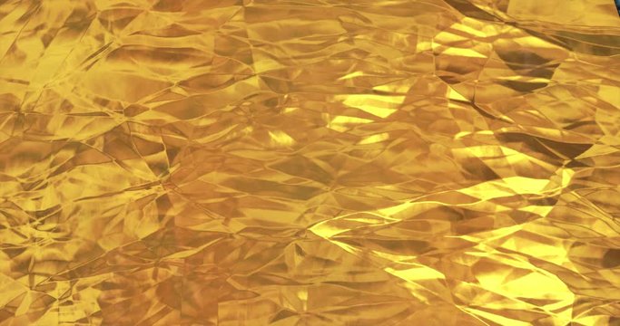 Golden foil background. Gold texture 3D rendering loop 4k