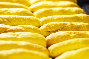 close up of yellow hot dog buns.