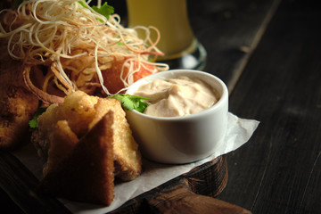 Glass of cold beer with appetizer. catering menu