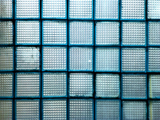 Square blue windows. The texture of the glass. Checkered abstract pattern background.