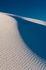 Closeup of the white sand dune showing a grainy sand texture