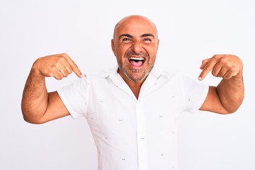 Middle age handsome man wearing elegant shirt standing over isolated white background looking...