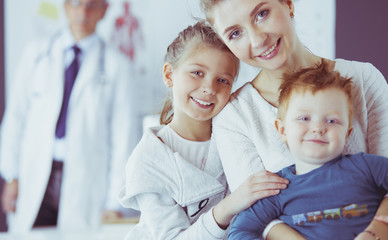 Little children with her mother at a doctor on consultation