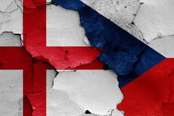 flags of England and Czechia painted on cracked wall